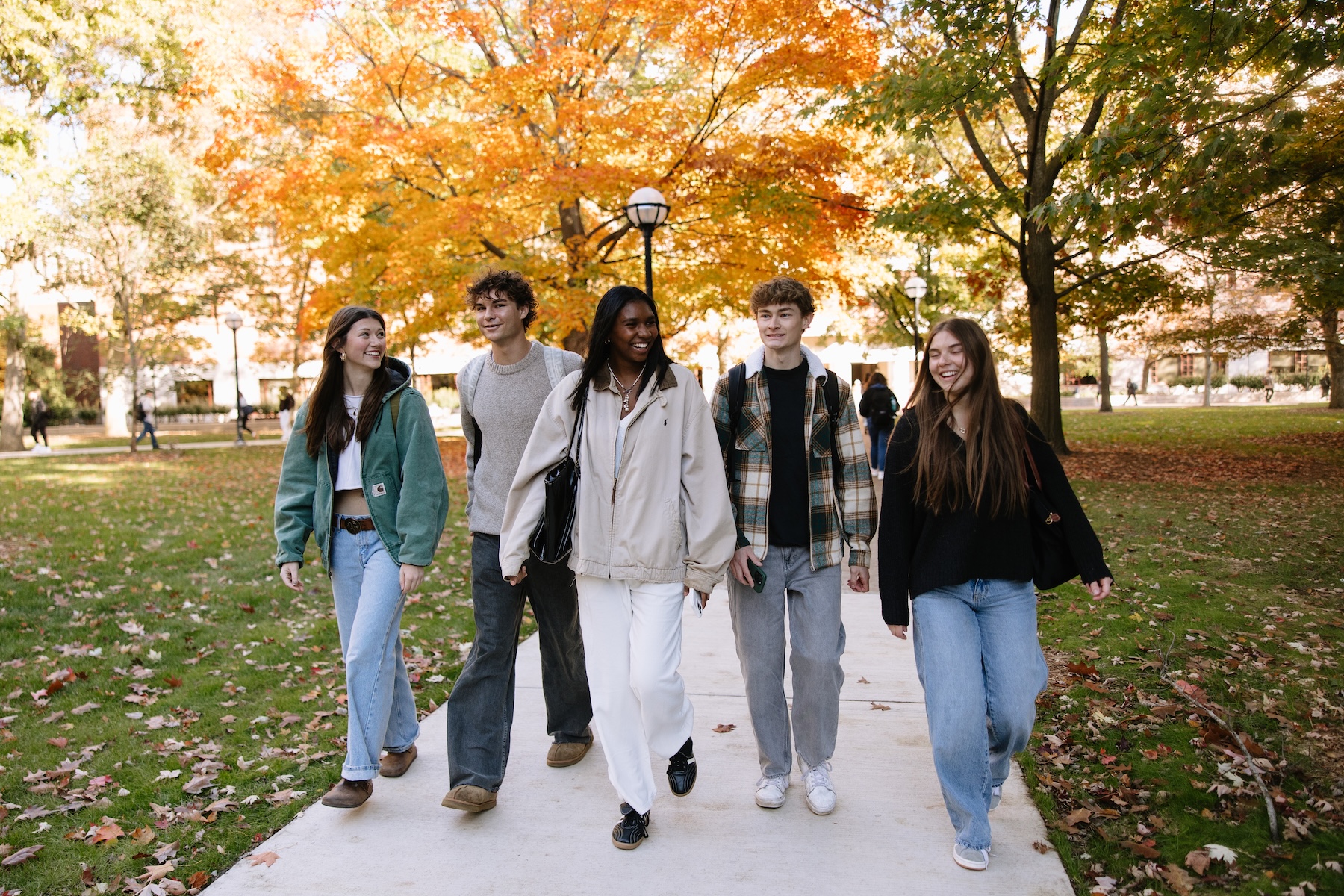 University of Michigan students walking in the Diag from Rambler Ann Arbor