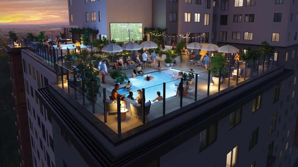 A rooftop pool area at Rambler Ann Arbor glows at sunset, with people swimming, relaxing under umbrellas, and gathering around fire pits. String lights and lush plants set the scene while a large screen shows a sports game in the background.